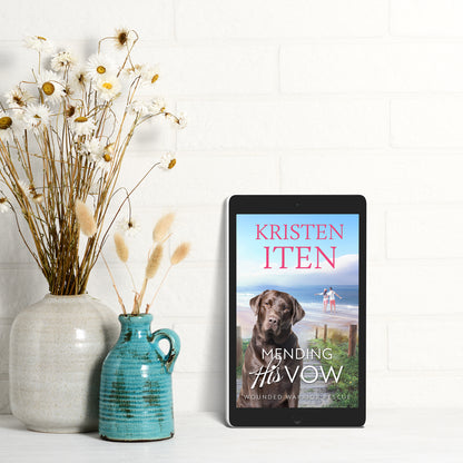 ebook cover of mending his vow next to vase of flowers